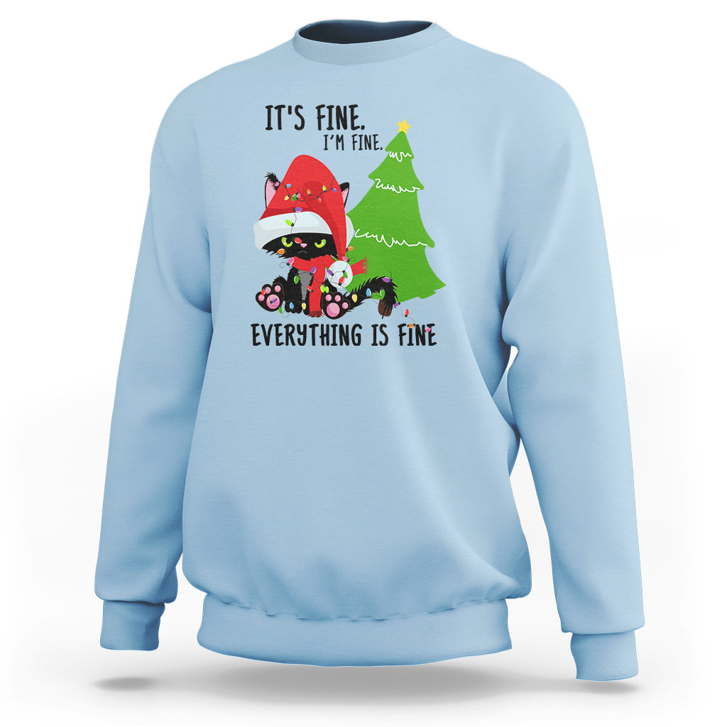 Light blue Christmas sweatshirt with cat-and-tree graphic and “It’s fine… Everything is fine” text