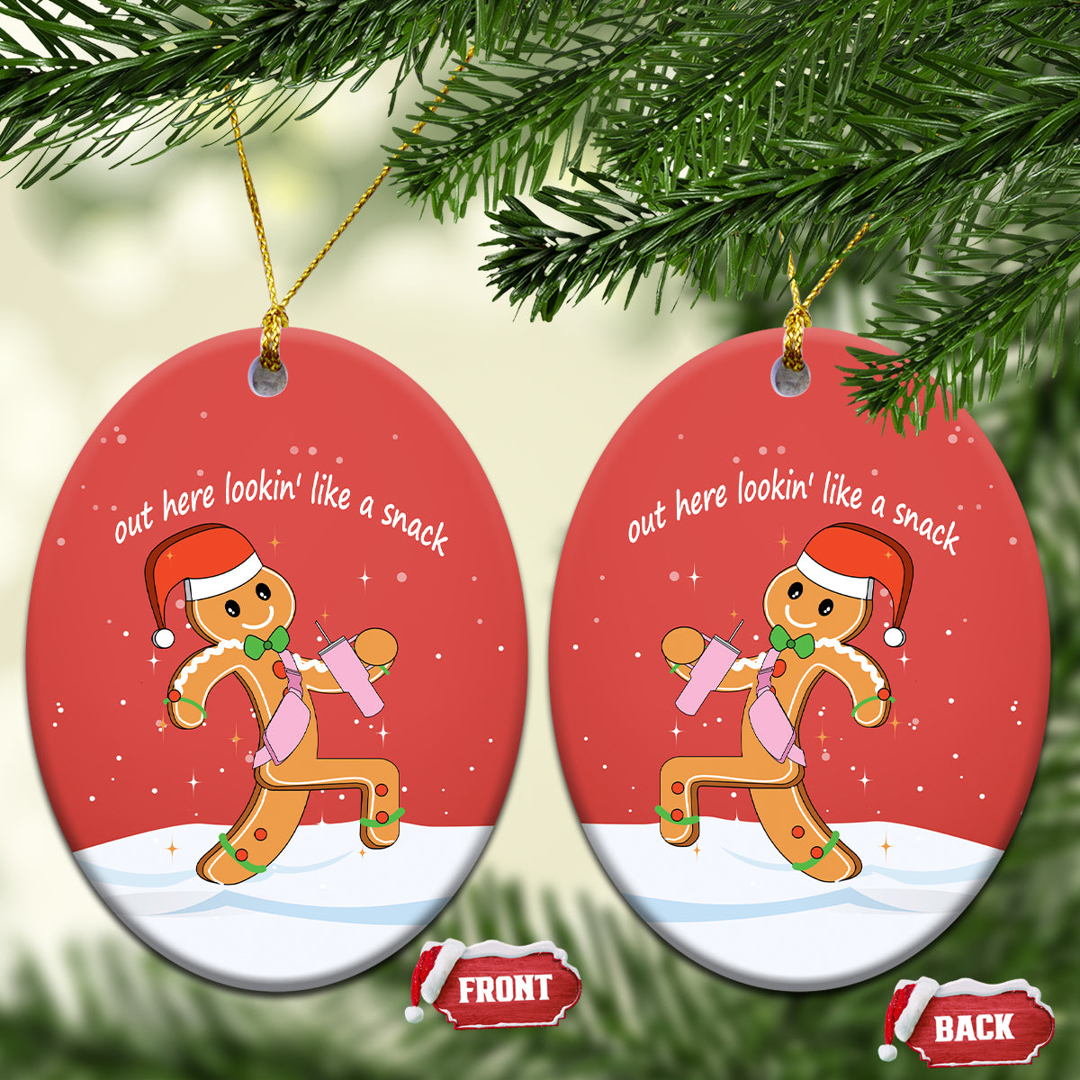 Red oval ceramic ornament with gingerbread runner graphic and gold hanging loop.
