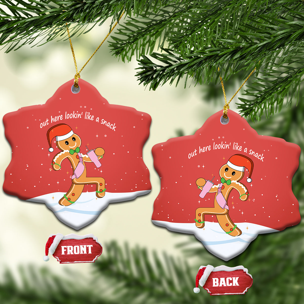 Red heart-shaped ceramic ornament featuring gingerbread runner graphic and gold hanging loop.