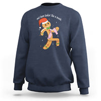Navy crewneck sweatshirt with colorful gingerbread man graphic on the chest