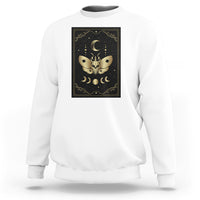 White crewneck sweatshirt with centered framed moth and moon tarot-style print on front