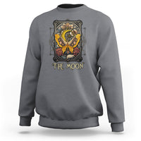 Charcoal gray crewneck sweatshirt with 'The Moon' tarot-style luna moth graphic on chest