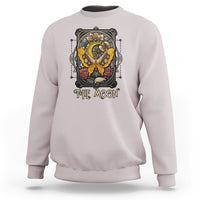 Ice gray crewneck sweatshirt with 'The Moon' tarot-style luna moth graphic on chest