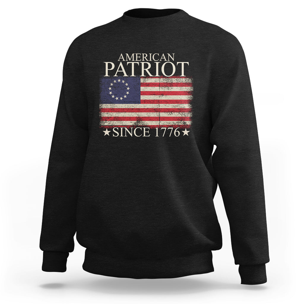 Black crewneck sweatshirt with American flag graphic and text “Since 1776”.