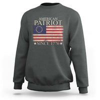 Dark heather gray crewneck sweatshirt with American flag graphic and “Since 1776”.