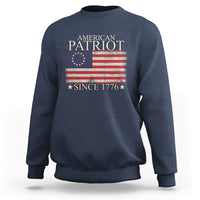 Navy crewneck sweatshirt with American flag graphic and “Since 1776” print.