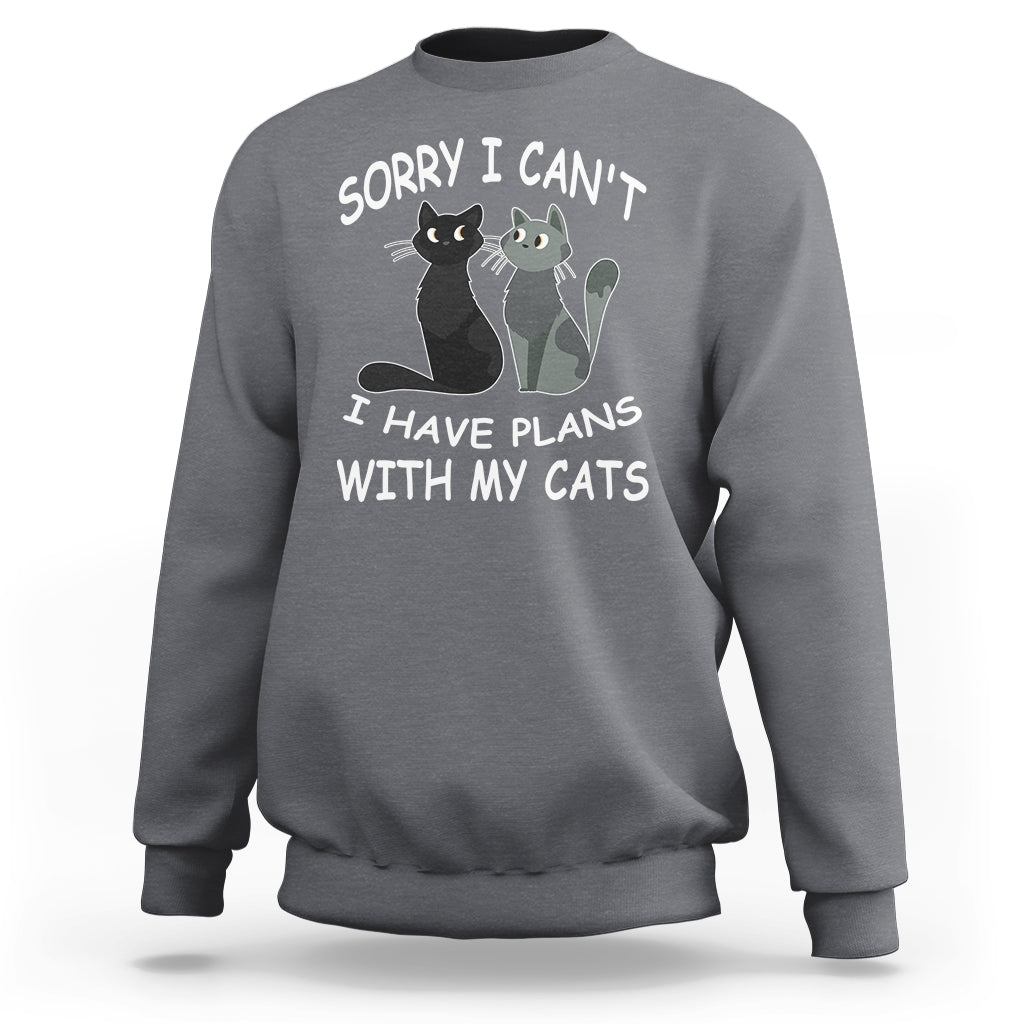 Dark heather gray cat lover sweatshirt with cat graphic and slogan “Sorry I can’t I have plans with my cats”.