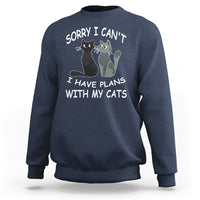 Navy cat lover sweatshirt with cat graphic and slogan “Sorry I can’t I have plans with my cats”.