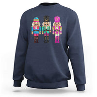 Navy crewneck sweatshirt with colorful sequin nutcracker graphic on the chest