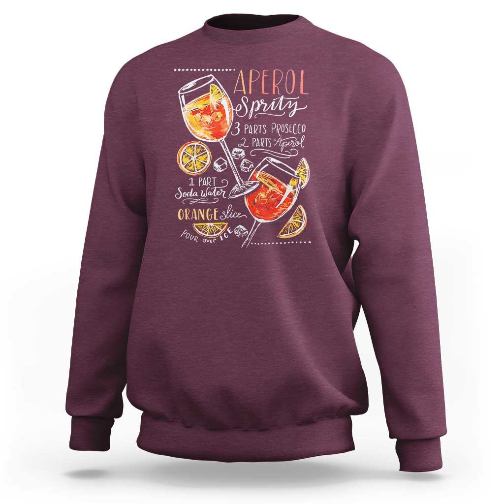 Maroon sweatshirt with Aperol Spritz cocktail graphic on front