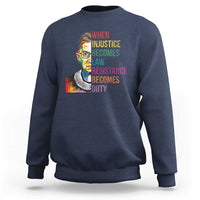 Navy crewneck sweatshirt with RBG-style portrait and resistance quote graphic on front