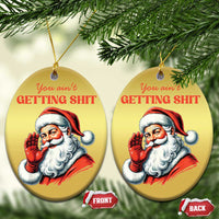 Two gold round Santa Christmas ornaments with hanging strings and “You ain’t getting…” text