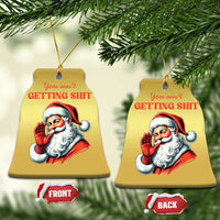 Two gold bell-shaped Santa Christmas ornaments with hanging strings and “You ain’t getting…” text