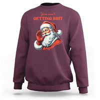 Maroon crewneck sweatshirt with Santa graphic and "You ain't getting shit" text