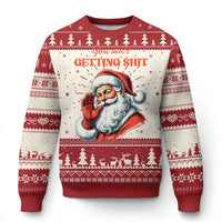 Christmas sweater with Santa graphic and 'GETTING SHIT' text, red and white fair isle
