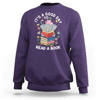 Purple sweatshirt with cartoon elephant reading book graphic and 'READ A BOOK' text