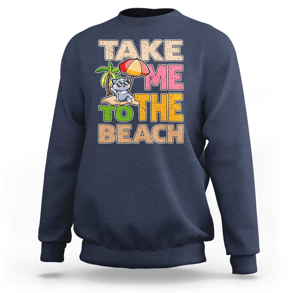 Navy blue sweatshirt with large “Take me to the beach” cat graphic