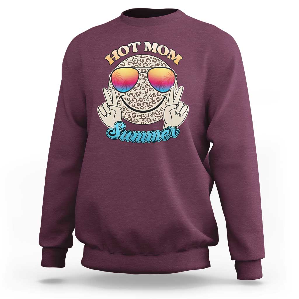 Maroon sweatshirt with leopard smiley and rainbow sunglasses graphic on front