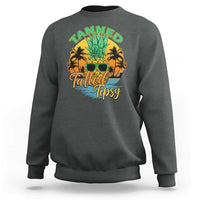 Dark heather gray crewneck sweatshirt with front 'Tanned Tatted Tipsy' pineapple tropical graphic
