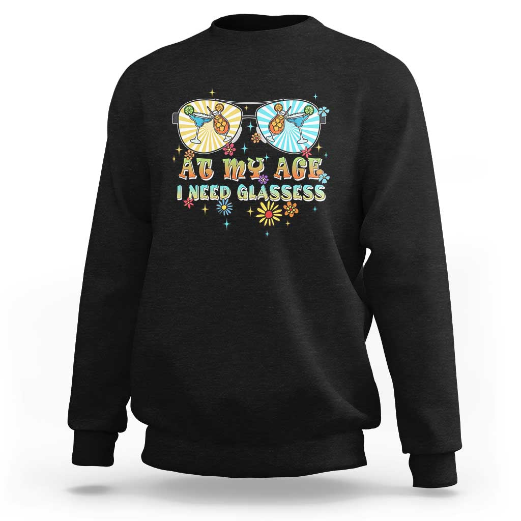 Unisex graphic crewneck sweatshirt in black, colorful “Age… need glasses” print.