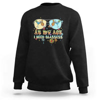 Unisex graphic crewneck sweatshirt in black, colorful “Age… need glasses” print.