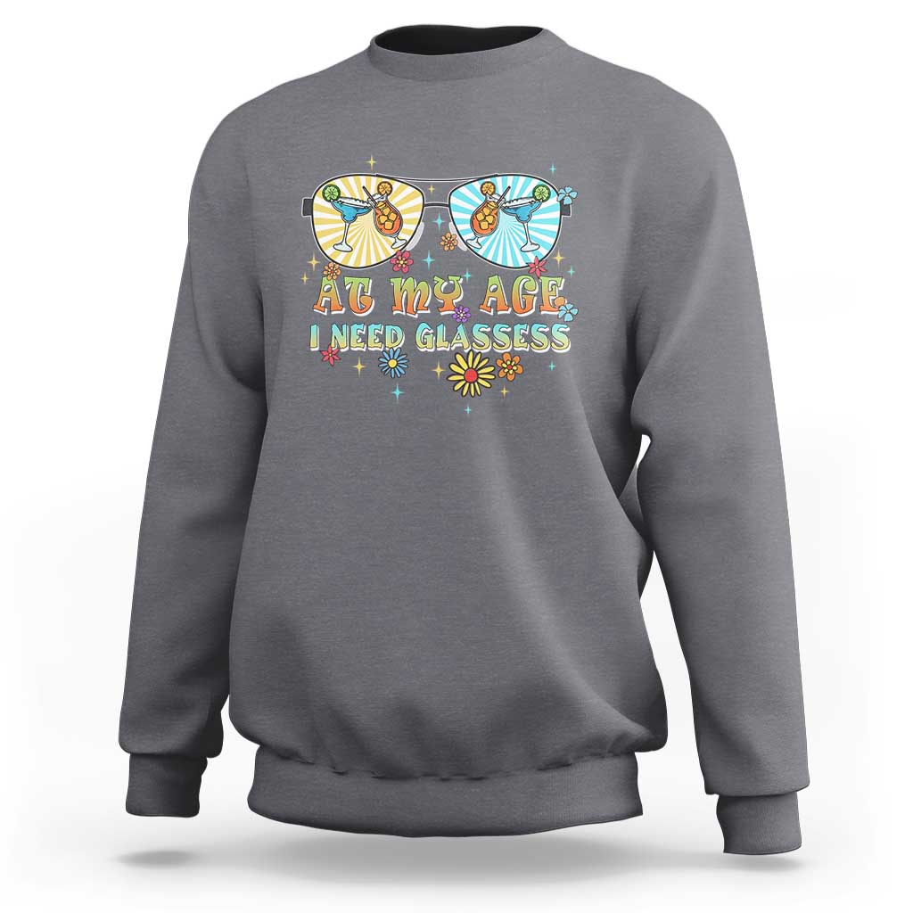 Unisex graphic crewneck sweatshirt in light heather gray, colorful “Age… need glasses” print.