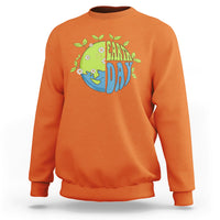 Orange sweatshirt with Earth Day “Earth Day” graphic on the chest