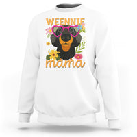 White sweatshirt with dachshund graphic and “Weennie mama” text on front