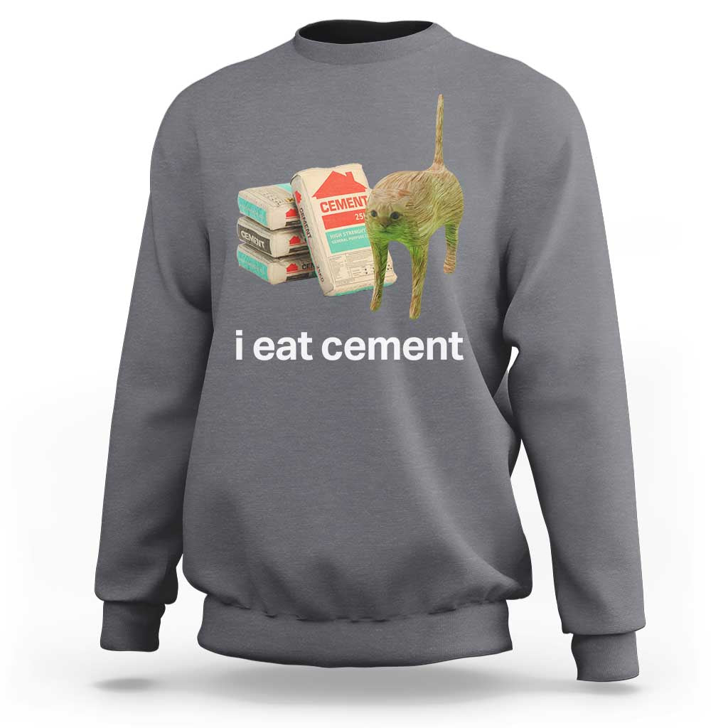 Dark heather gray crewneck sweatshirt with 'i eat cement' cat graphic on front