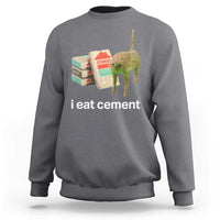 Dark heather gray crewneck sweatshirt with 'i eat cement' cat graphic on front