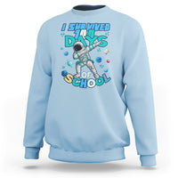 Light blue crewneck sweatshirt with astronaut dabbing graphic and school days print