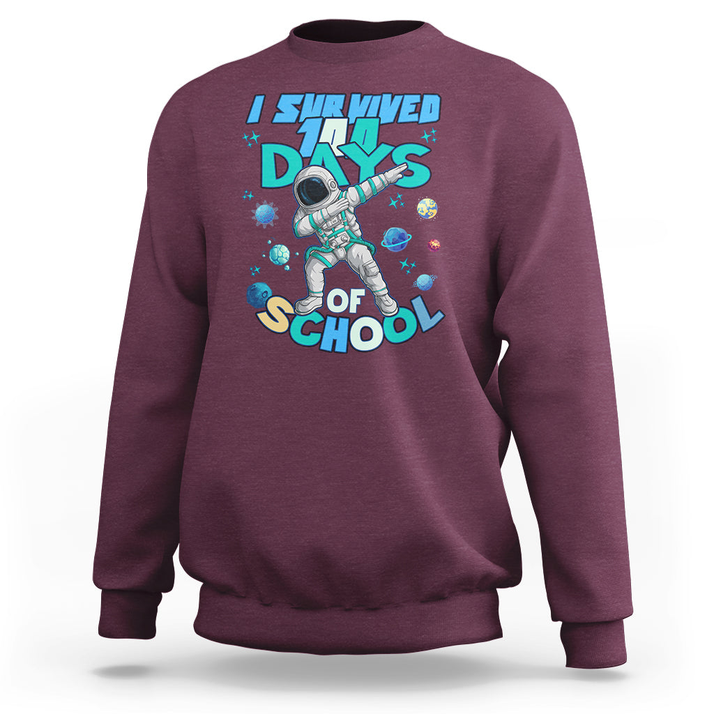 Maroon crewneck sweatshirt with astronaut dabbing graphic and school days print
