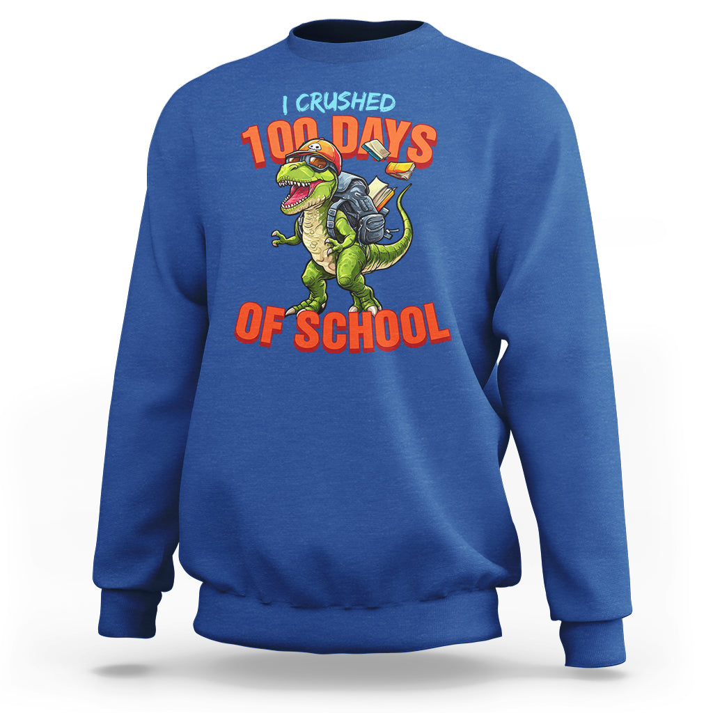 Royal blue sweatshirt with dinosaur '100 Days of School' front graphic.