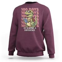 Maroon dinosaur graphic sweatshirt, crew neck with “100 Days” themed text