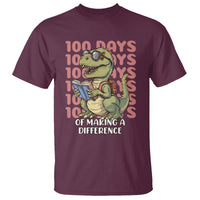 Maroon short-sleeve crewneck T-shirt with colorful dinosaur and “100 days of making a difference” print