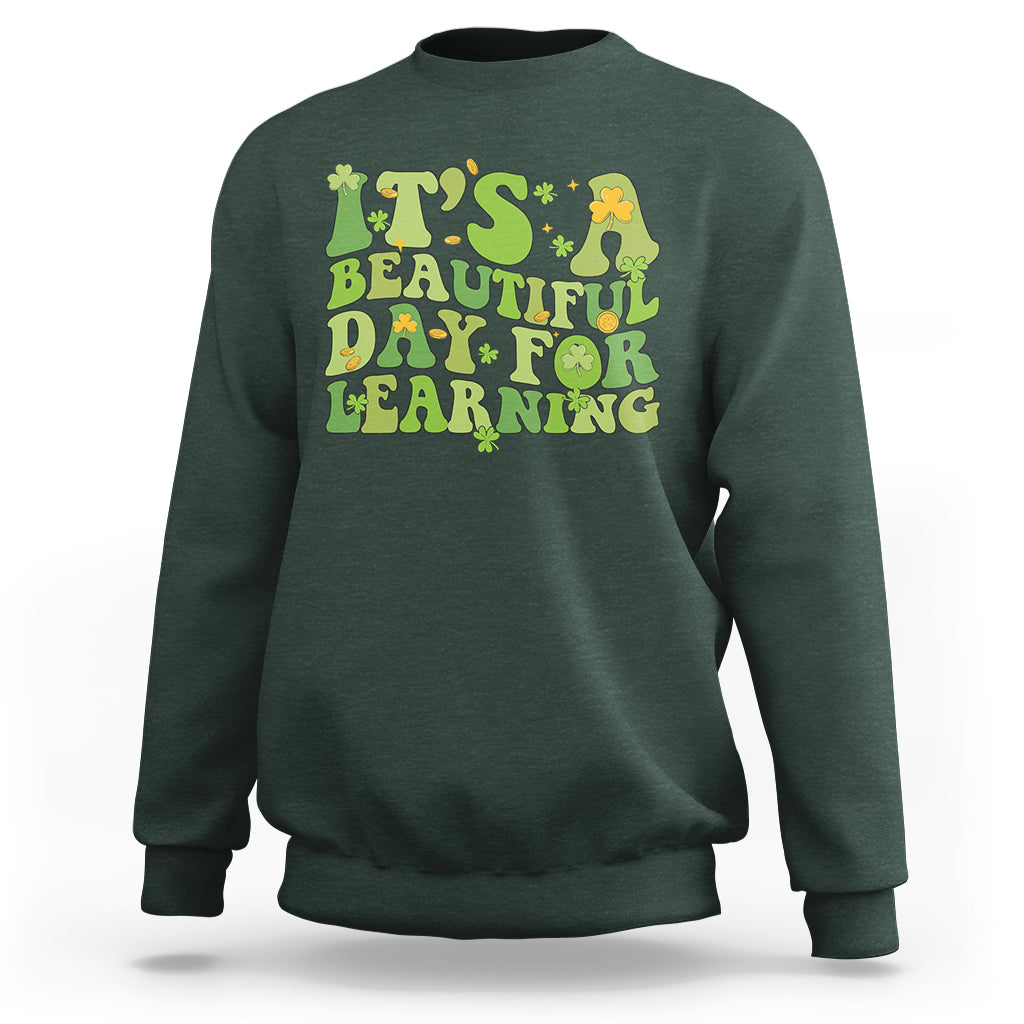 Forest green students sweatshirt with green and yellow text graphic: "It's Beautiful Day for Learning".