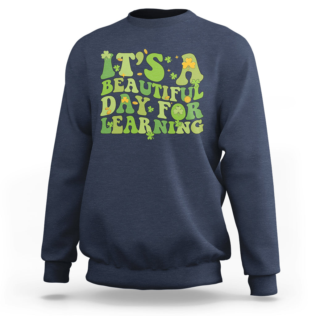 Navy students sweatshirt with green and yellow text graphic: "It's Beautiful Day for Learning".