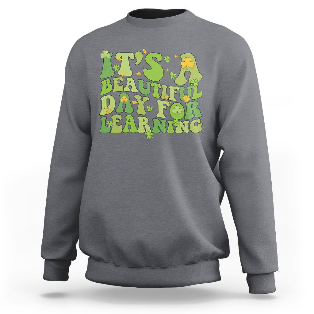 Charcoal gray students sweatshirt with green and yellow text graphic: "It's Beautiful Day for Learning".