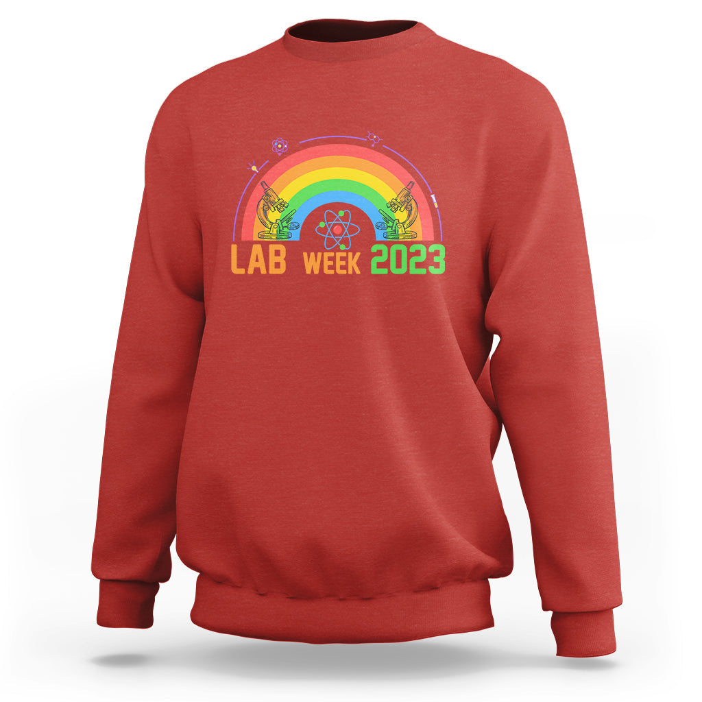 Crewneck lab sweatshirt in red with Lab Week 2023 rainbow graphic