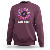Maroon lab tech sweatshirt with colorful sunflower burst graphic and white “LAB TECH” text