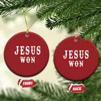 Set of two red round ornaments with 'JESUS WON' on front and back, gold hanging cords.