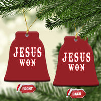 Red bell-shaped Christmas ornament with 'JESUS WON' text and a gold hanging loop.
