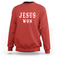 Red crewneck sweatshirt with “JESUS WON” graphic on the chest