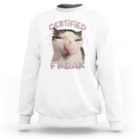 White crewneck sweatshirt with “CERTIFIED FREAK” cat graphic on chest