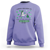 Purple nurse sweatshirt with green shamrock graphic and Labor & Delivery text