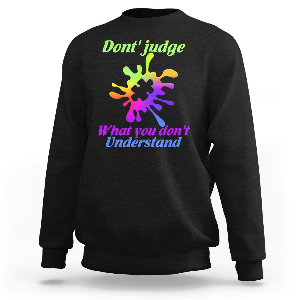 Black sweatshirt with autism puzzle graphic: “Don't judge” and “What you don't Understand”