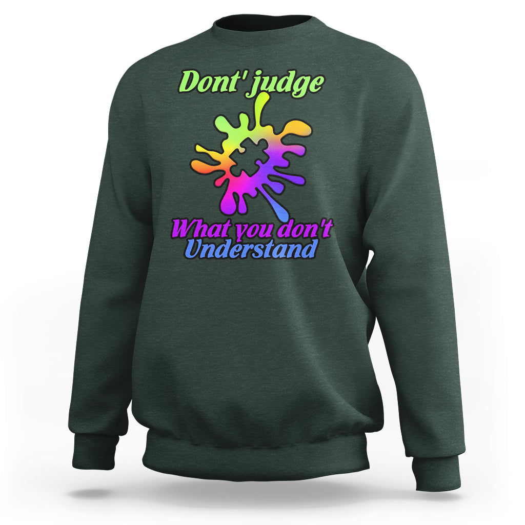 Forest green sweatshirt with autism puzzle graphic: “Don't judge” and “What you don't Understand”
