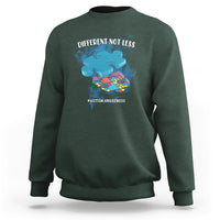 Forest green crewneck sweatshirt with “DIFFERENT NOT LESS” autism awareness graphic