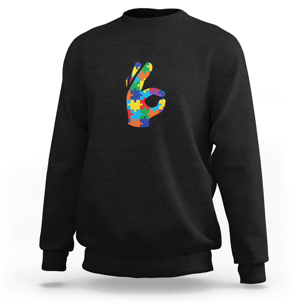 Black crewneck sweatshirt with colorful puzzle-style 3 graphic on the front