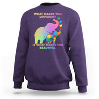 Purple crewneck sweatshirt with autism elephant graphic and 'What makes you different' text